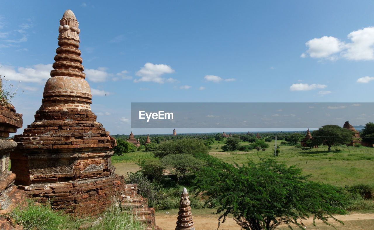 temple - building, religion, travel destinations, architecture, sky, history, belief, ancient, travel, landmark, nature, built structure, landscape, the past, spirituality, environment, temple, ancient history, no people, tourism, cloud, plant, building, place of worship, pagoda, ruins, archaeological site, historic site, tower, outdoors, old ruin, land, scenics - nature, tree, ancient civilization, building exterior, culture, day, old, blue, business finance and industry, beauty in nature, industry