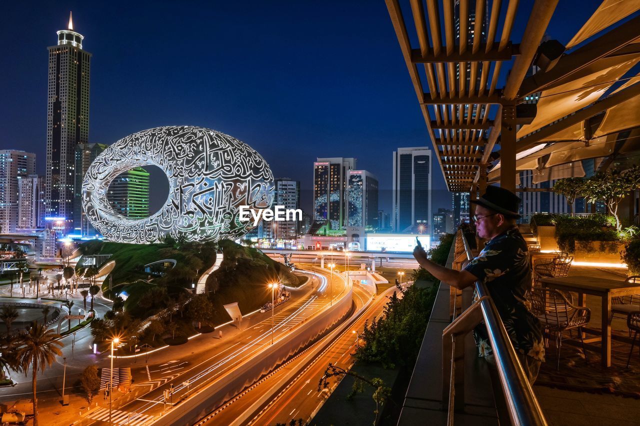 High angle view of illuminated buildings in city at night