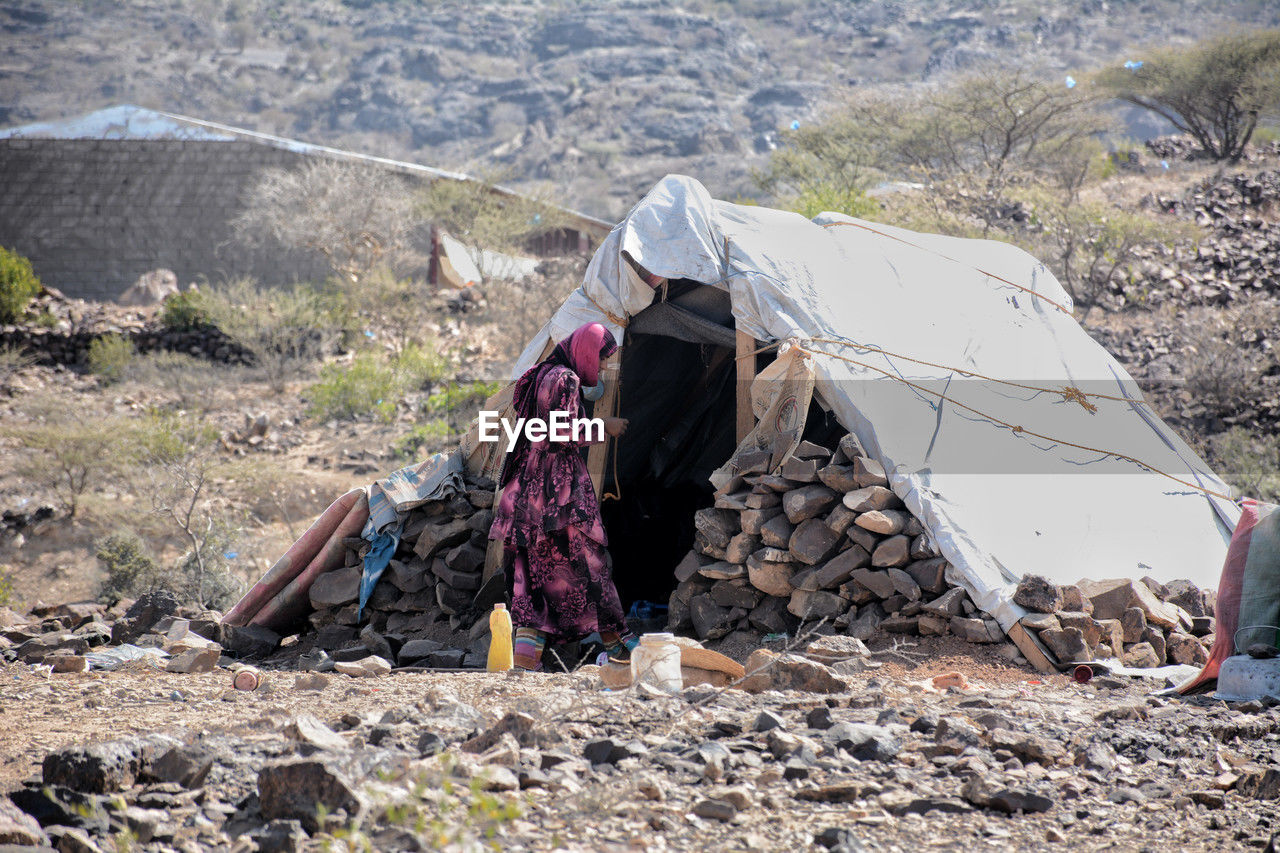 wilderness, nature, tent, environment, backpacking, mountain, landscape, camping, adventure, walking, day, land, geology, hiking, hiking equipment, scenics - nature, adult, clothing, remote, outdoors, non-urban scene, travel, one person, leisure activity, sunlight, travel destinations, activity