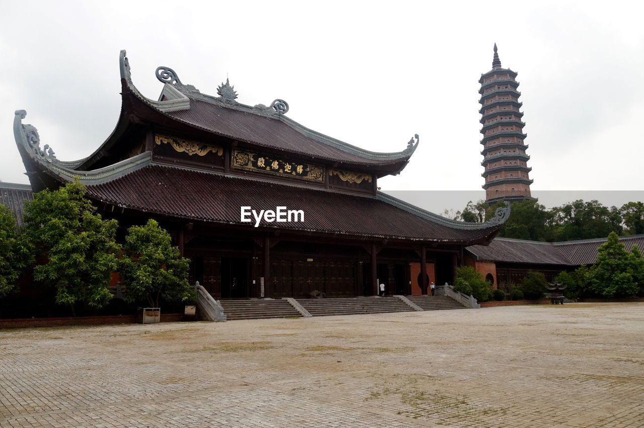 TEMPLE BY ROOF AGAINST SKY