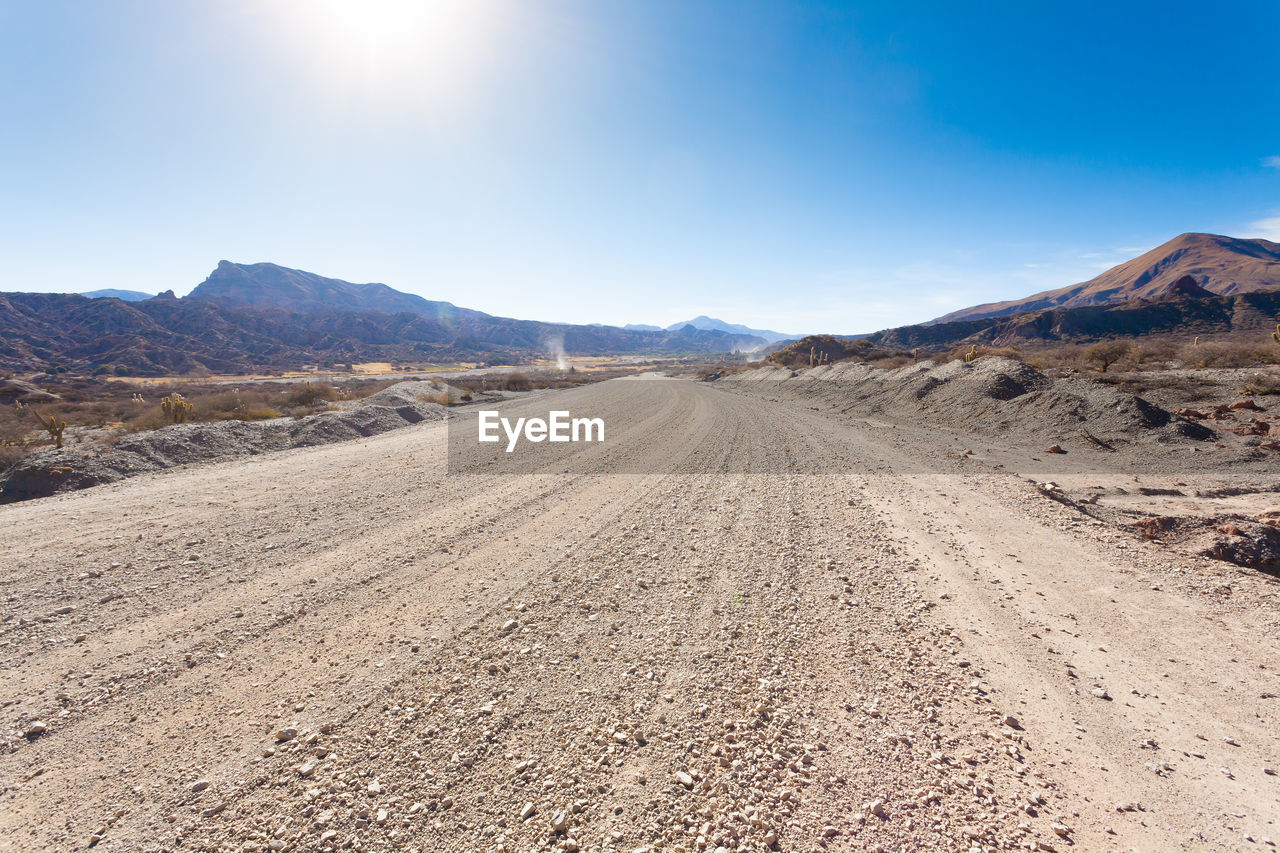 VIEW OF DIRT ROAD IN DESERT