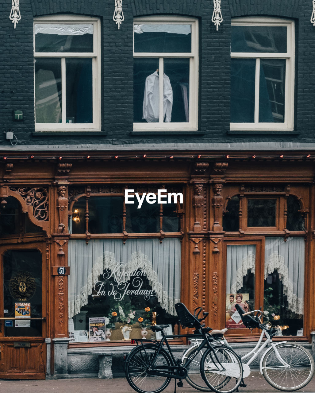 BICYCLES ON STREET BY BUILDING