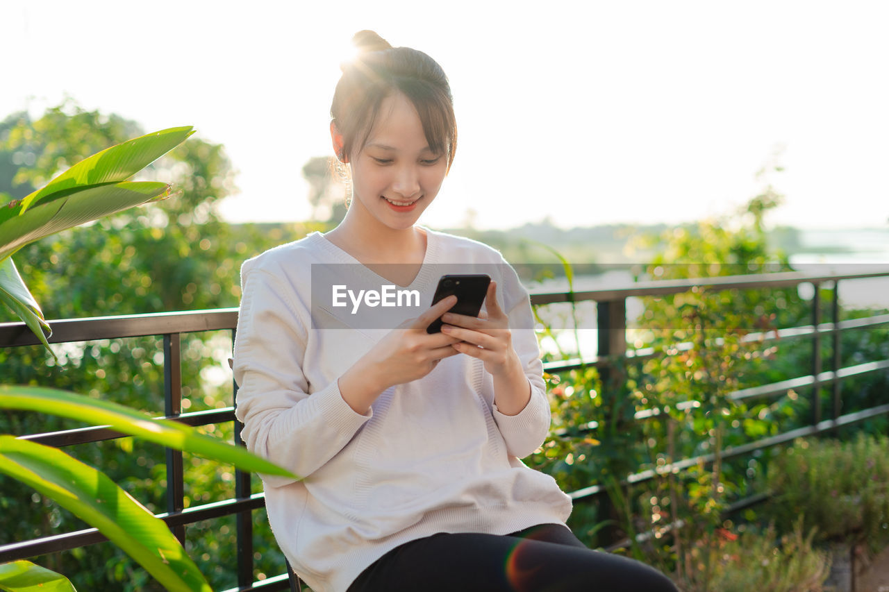 young woman using phone