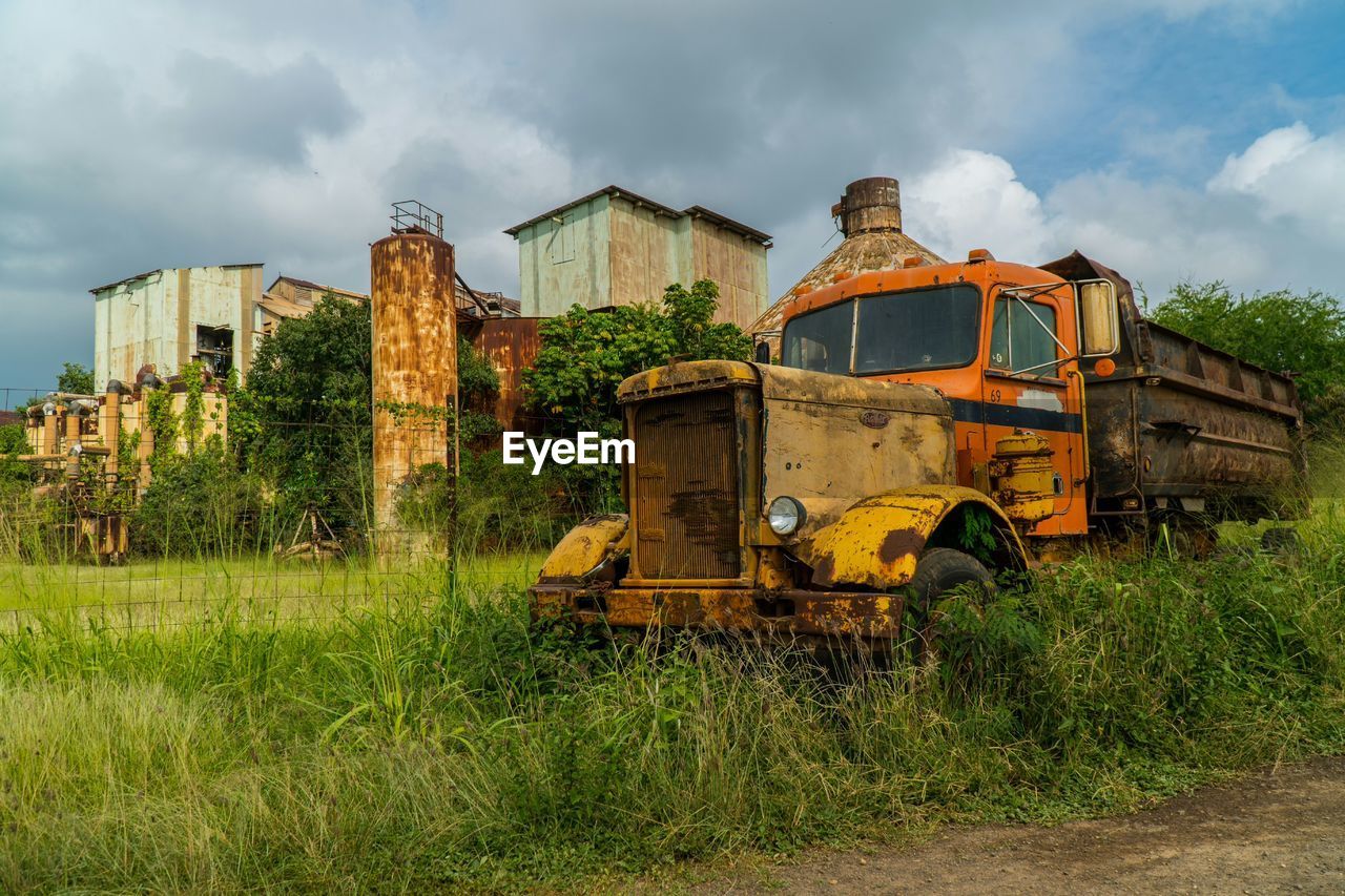 ABANDONED BUILDING AGAINST CLOUDY SKY