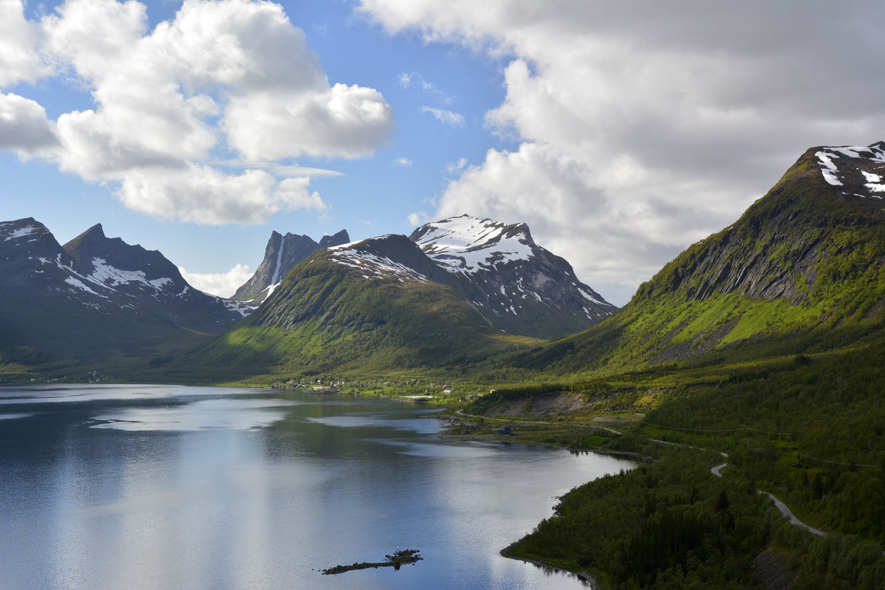 Scenic view of lake and mountains against sky
