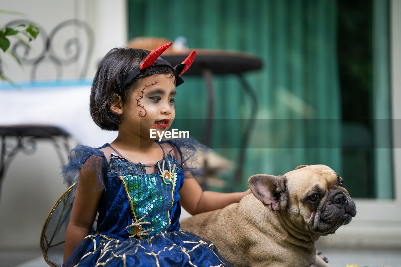 Portrait of cute girl with dog