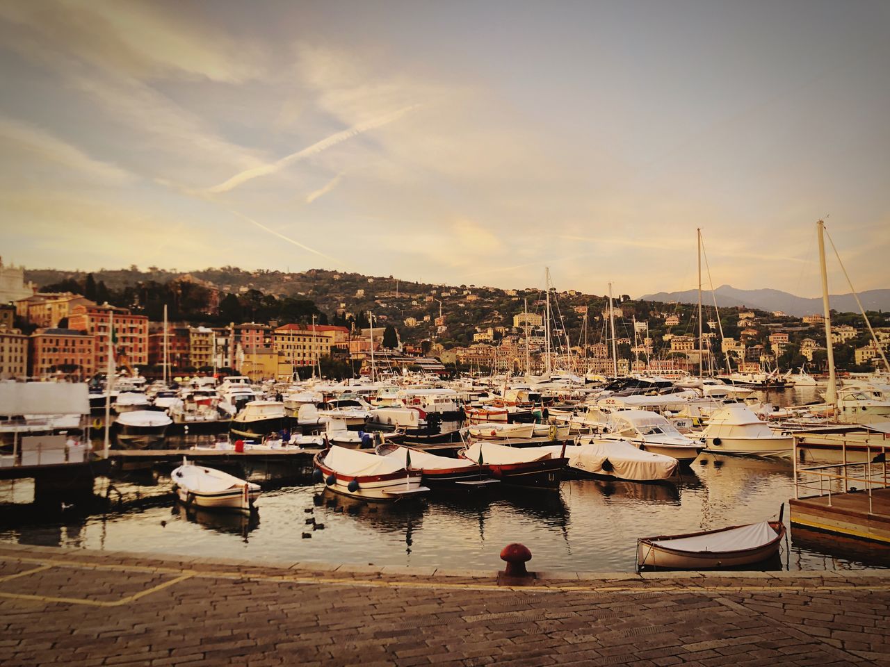 BOATS MOORED IN HARBOR