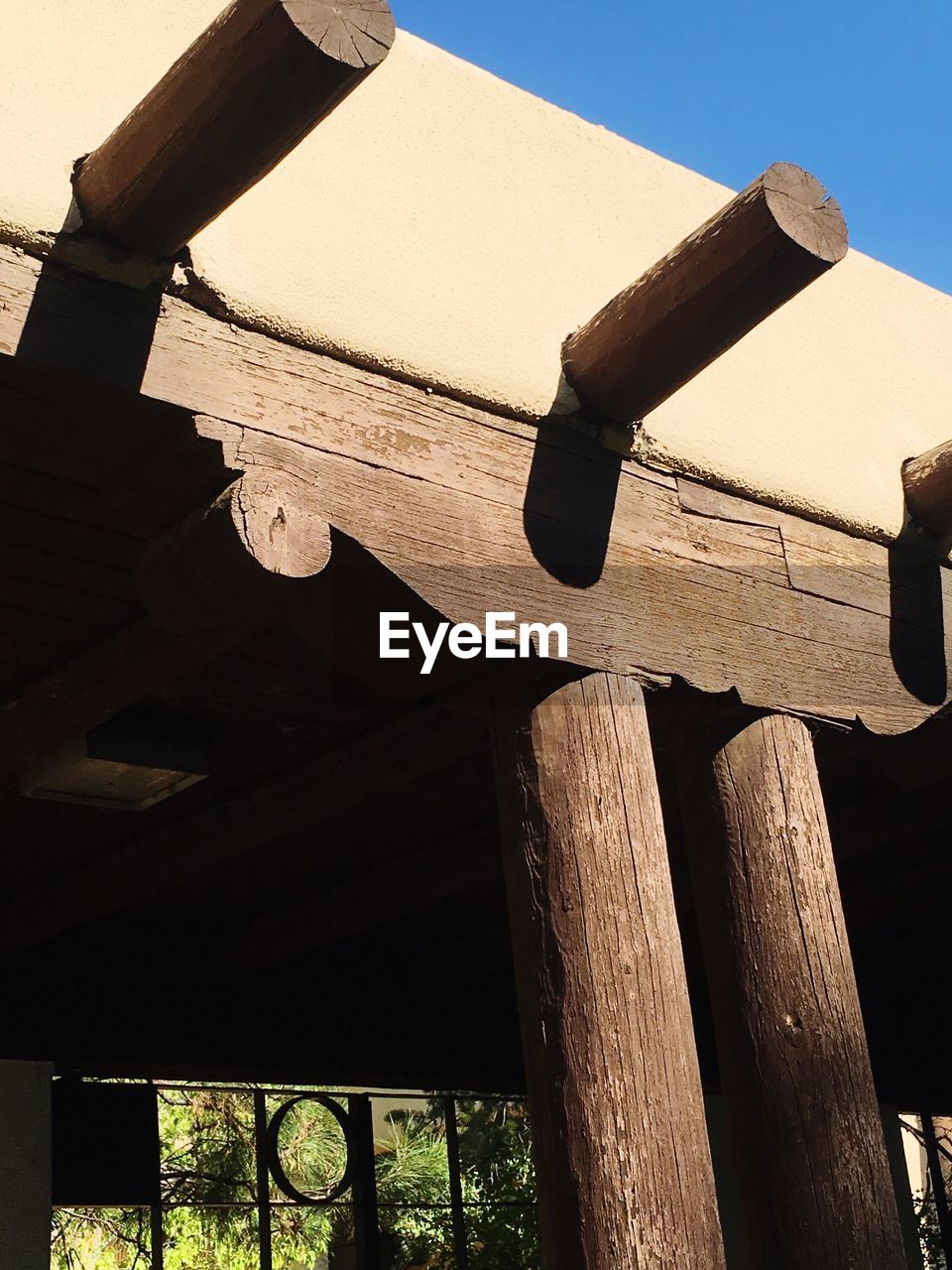 Low angle view of wooden pole against clear sky