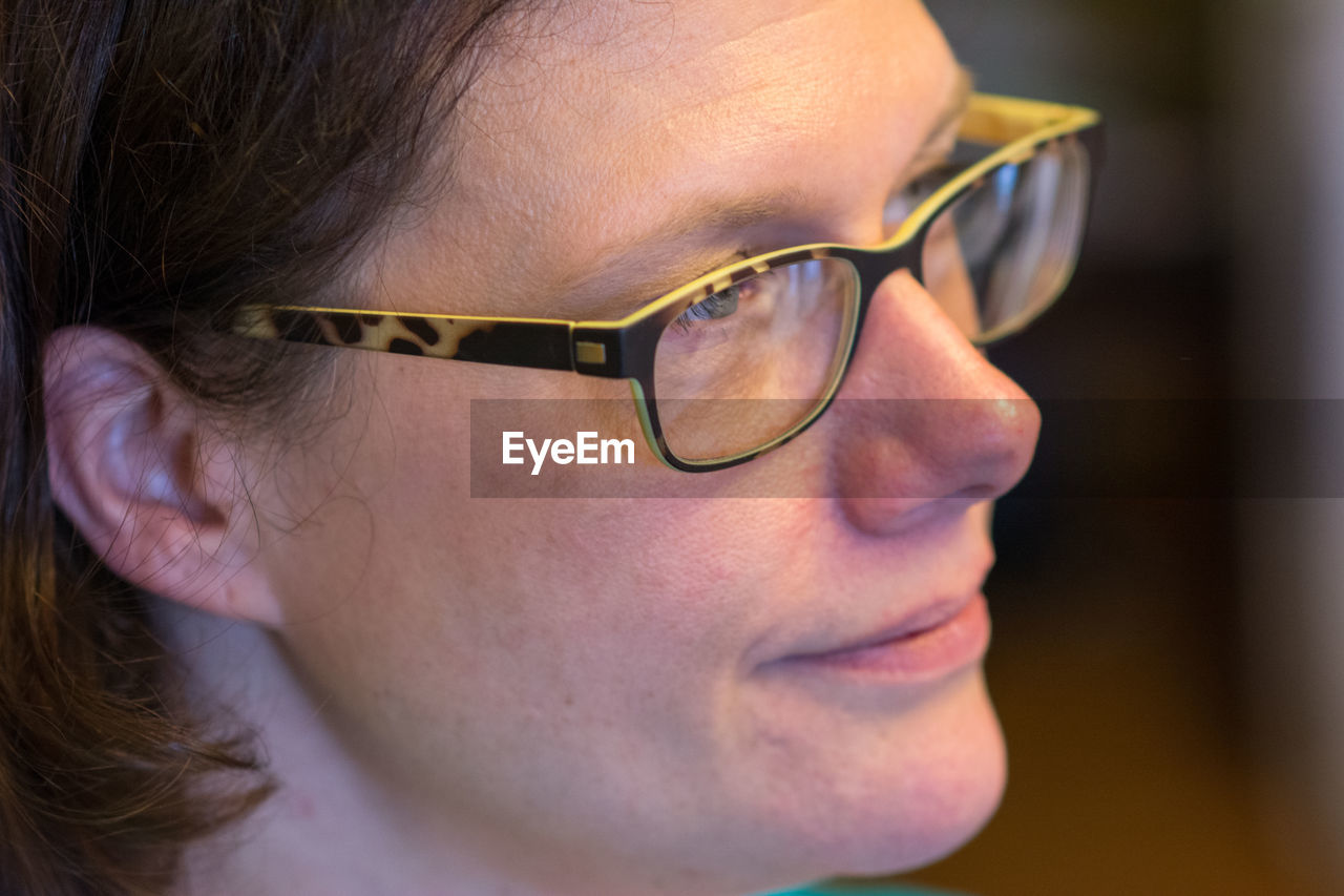 Close-up of woman wearing eyeglasses