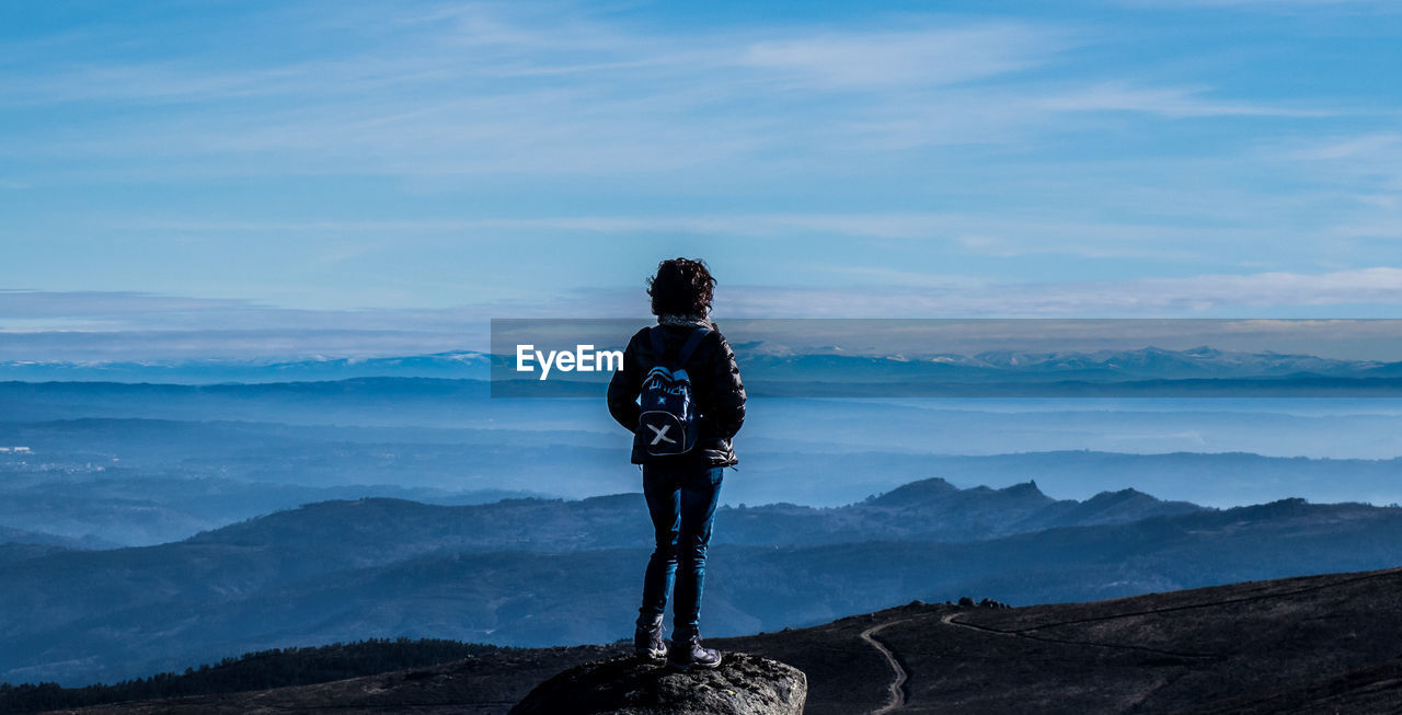 Person overlooking scenic landscape