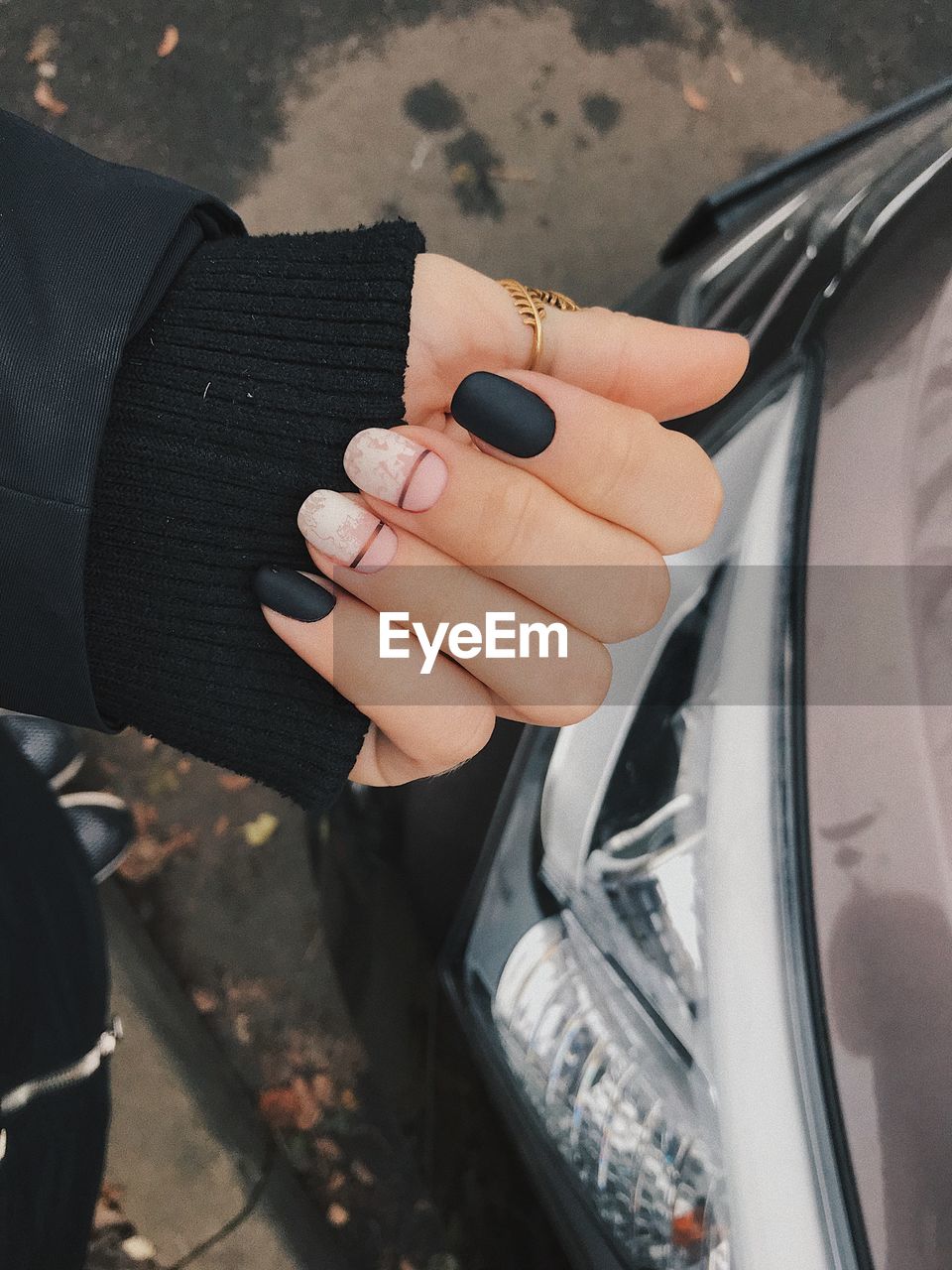 Close-up of woman hand holding car