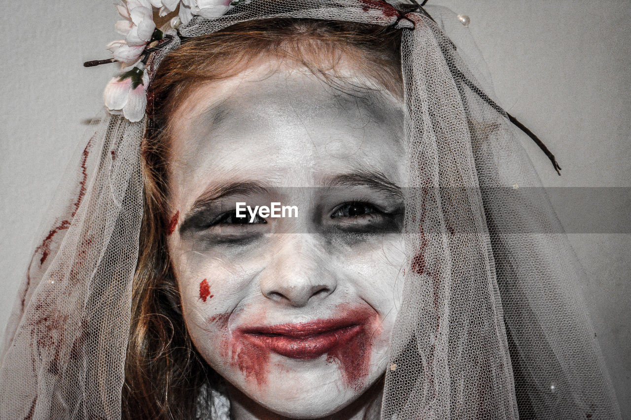 Close-up portrait of girl with make-up during halloween