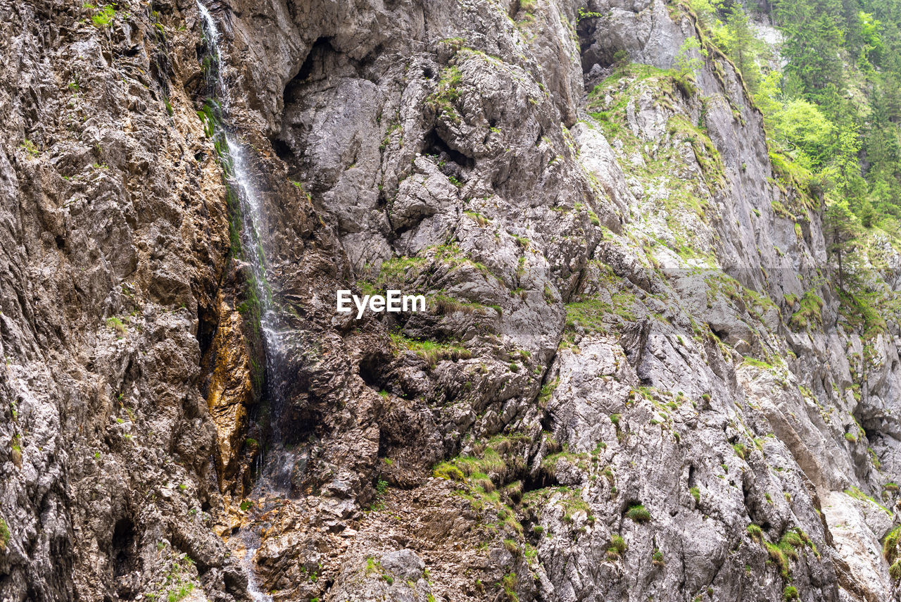 LOW ANGLE VIEW OF ROCKS ON ROCK