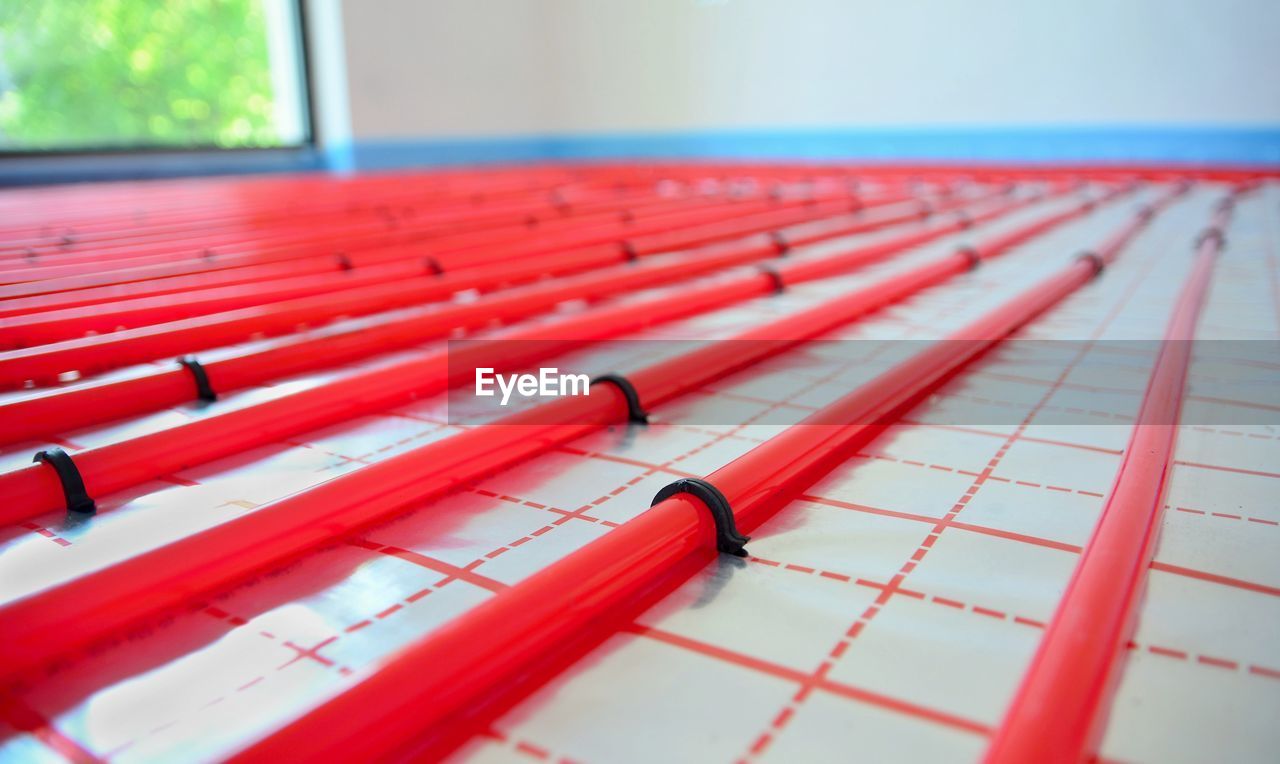 Close-up of pipes on surface in room