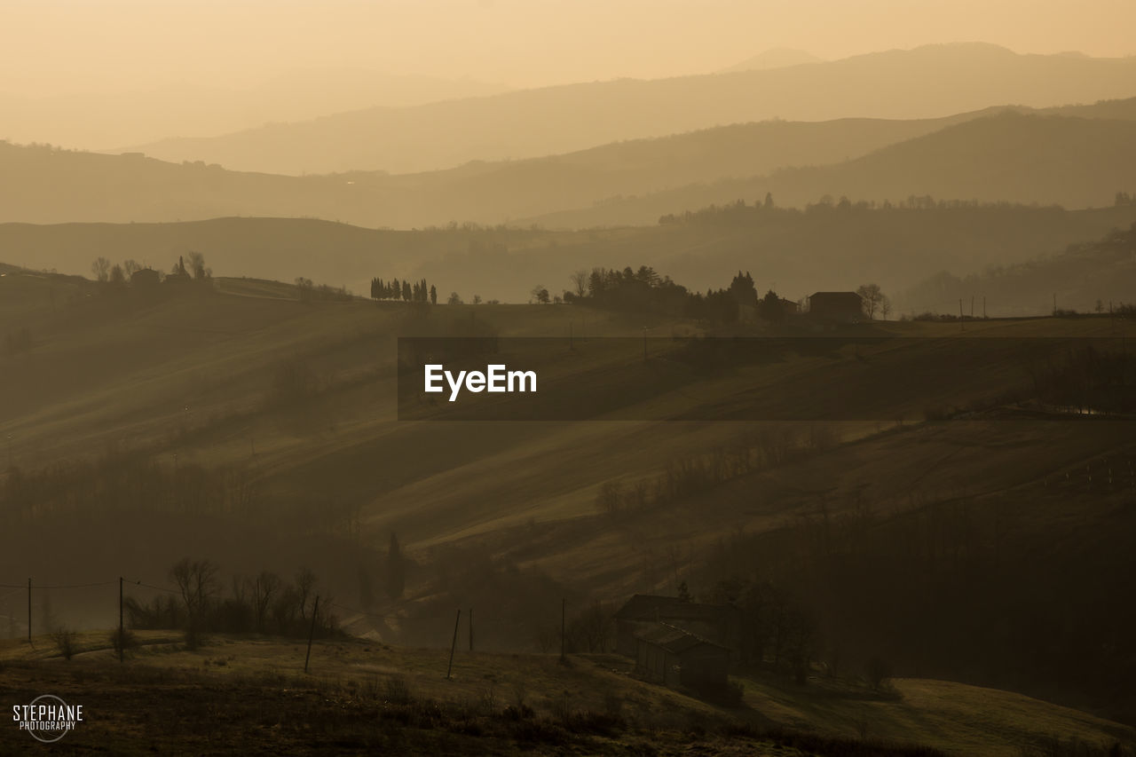 Scenic view of landscape against sky during sunset