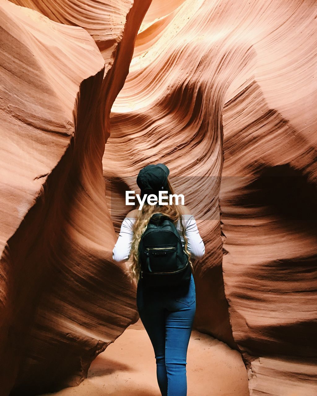 Rear view of tourists in cave