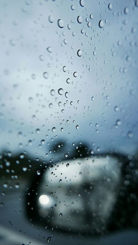 CLOSE-UP OF WATER DROPS ON WINDOW