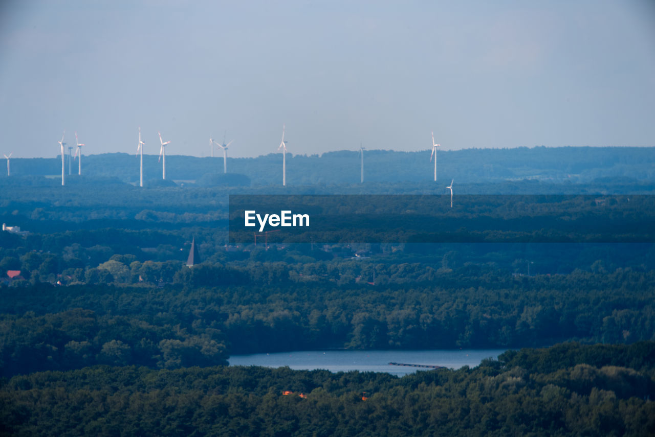 SCENIC VIEW OF WIND TURBINES ON LANDSCAPE AGAINST SKY