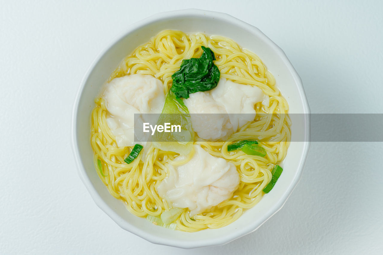 food and drink, food, healthy eating, dish, bowl, pasta, wellbeing, freshness, italian food, cuisine, vegetable, indoors, spaghetti, produce, directly above, studio shot, herb, meal, no people, high angle view, garnish, noodle, asian food, serving size, plate, gourmet, savory food, dairy, still life