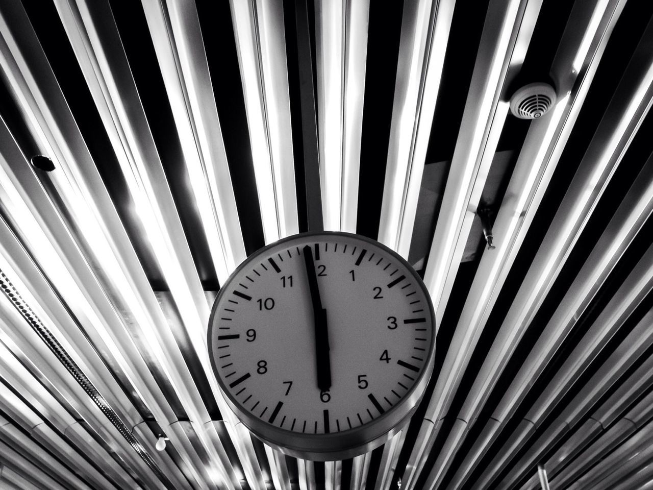 CLOSE-UP OF CLOCK ON CEILING