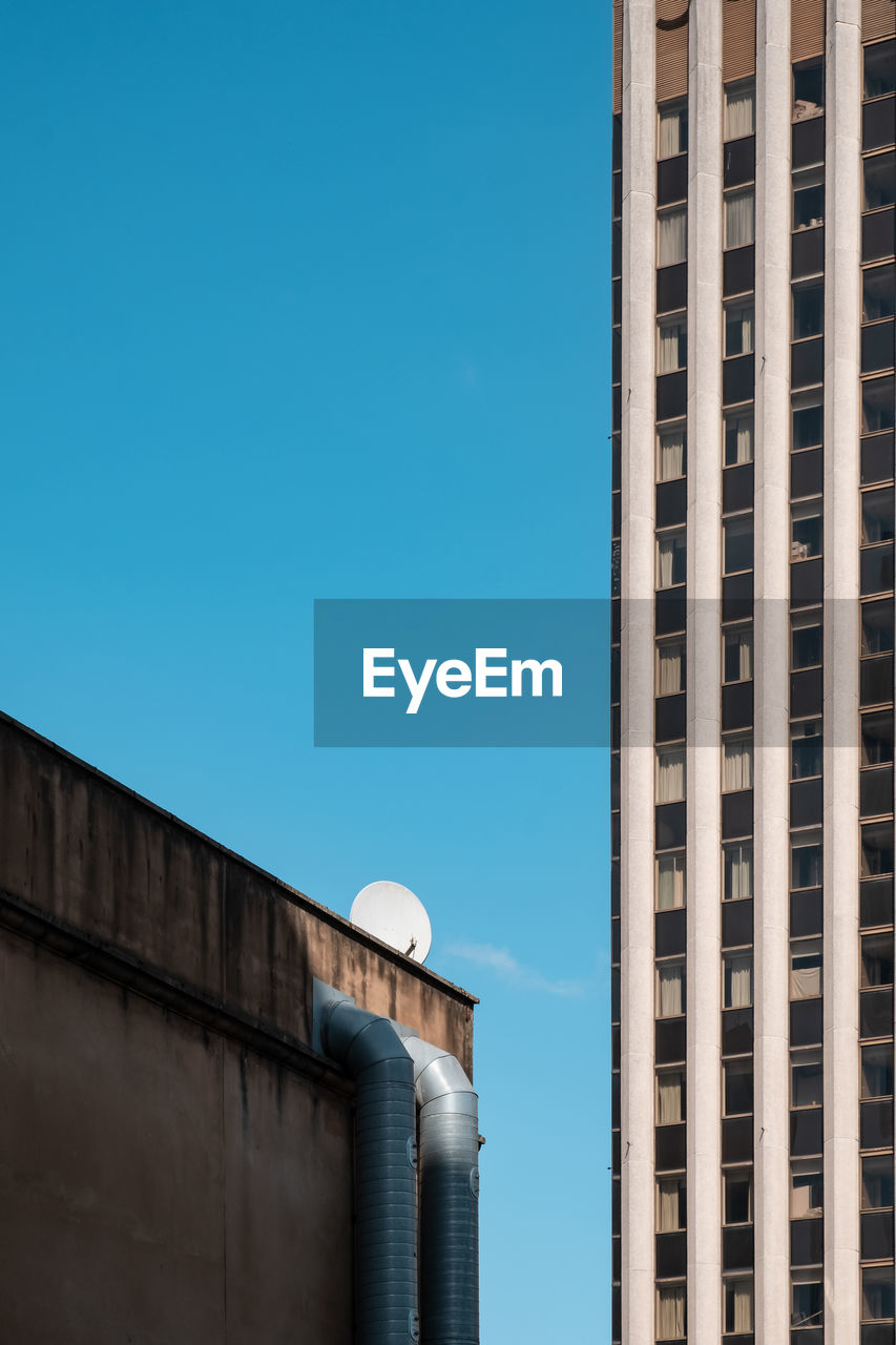 Low angle view of building against blue sky