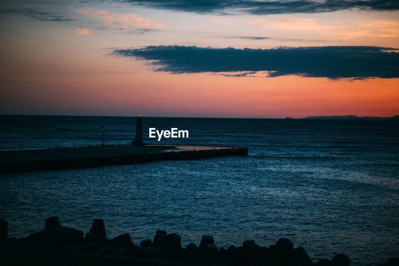 Scenic view of sea against sky during sunset