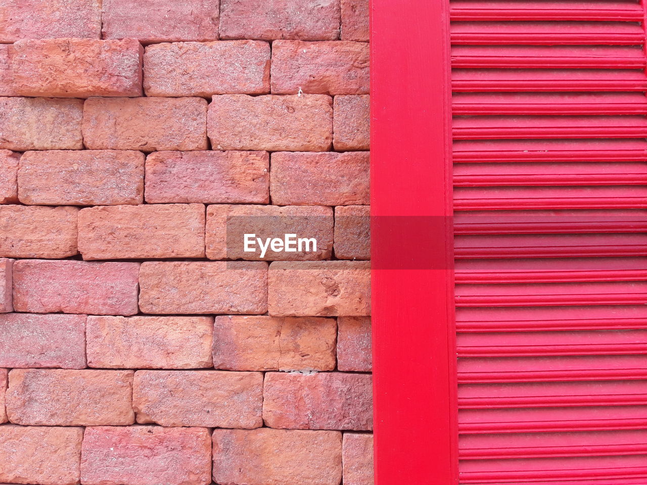 FULL FRAME SHOT OF WALL WITH PINK BRICK