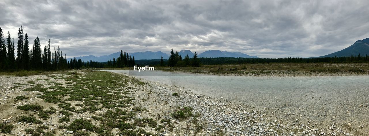 SCENIC VIEW OF LANDSCAPE AND MOUNTAINS AGAINST SKY