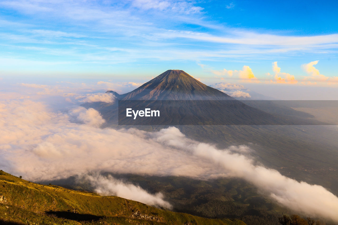 View of volcanic landscape against cloudy sky