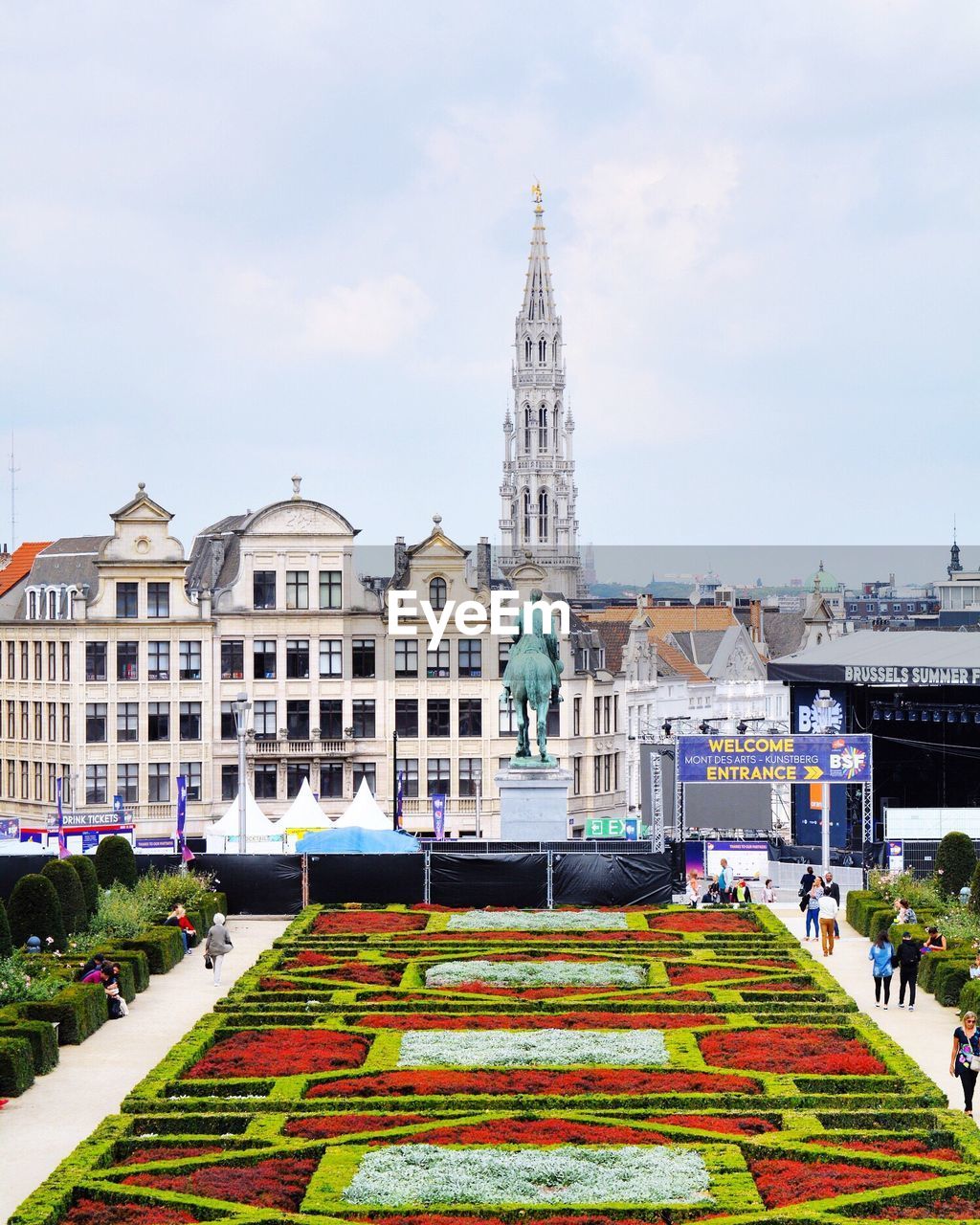 Public park with buildings in city against sky