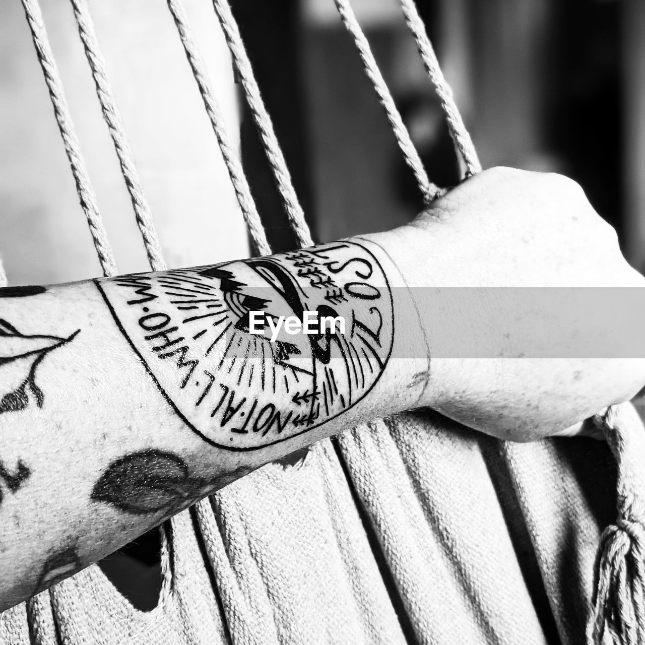 black and white, monochrome photography, one person, monochrome, hand, adult, white, close-up, focus on foreground, black, tattoo, arm, day, pattern, lifestyles