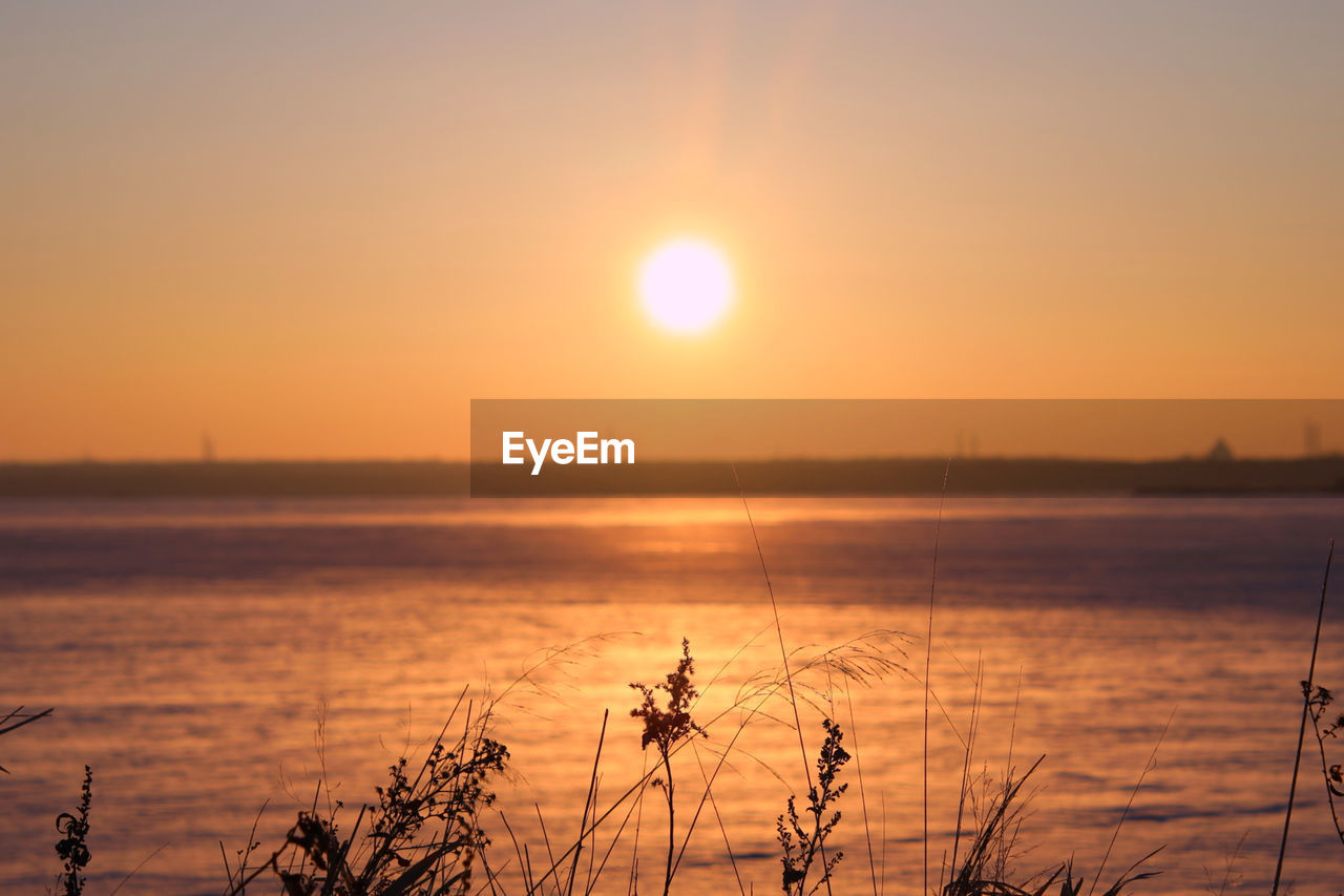 Scenic view of sea against sky during sunset