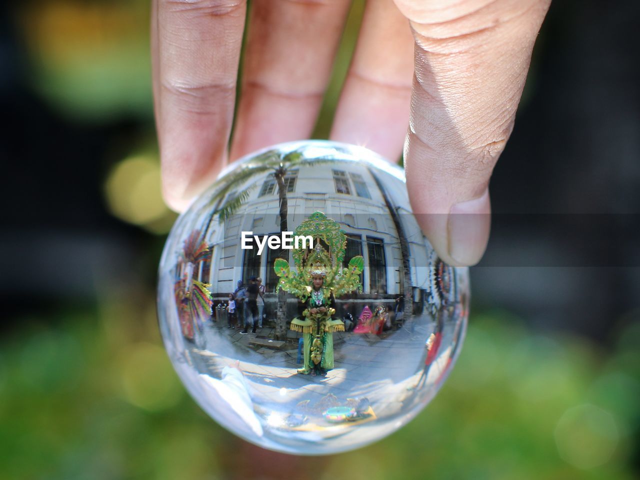 sphere, hand, holding, close-up, globe - man made object, green, crystal ball, one person, nature, glass, planet earth, environmental conservation, focus on foreground, reflection, macro photography, transparent, environment, outdoors, business, day, fortune telling, adult, shape, ball, planet, men, environmental issues, space, fragility