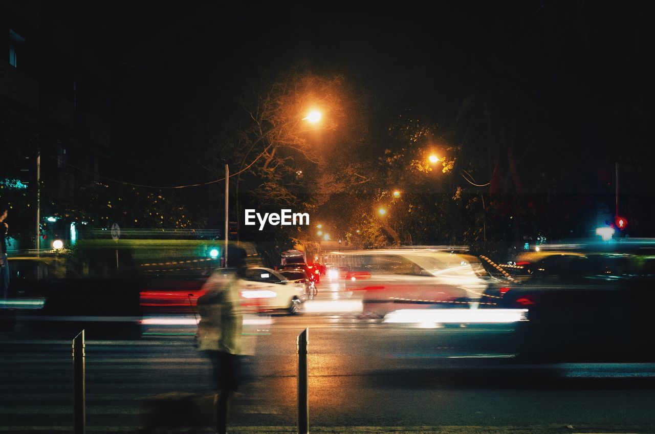 CARS ON STREET AT NIGHT