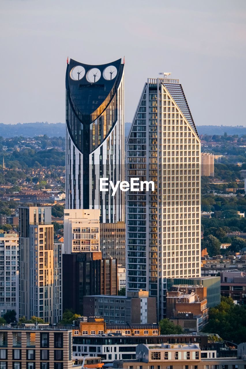 Modern buildings against sky in city