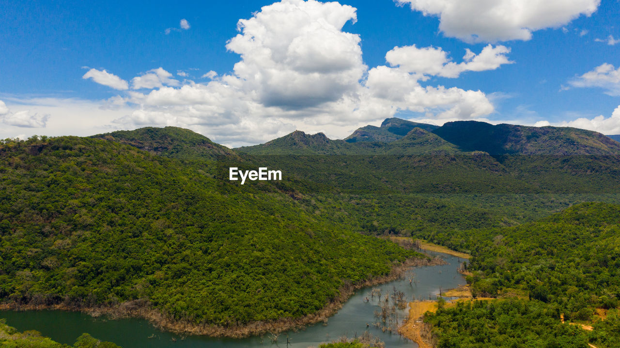 Tropical landscape mountains and jungle hills with lake.  kalu ganga reservoir, sri lanka.