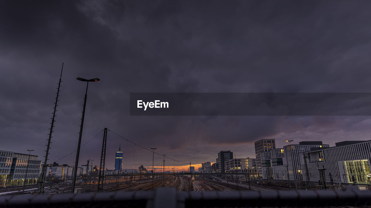 Illuminated cityscape against sky