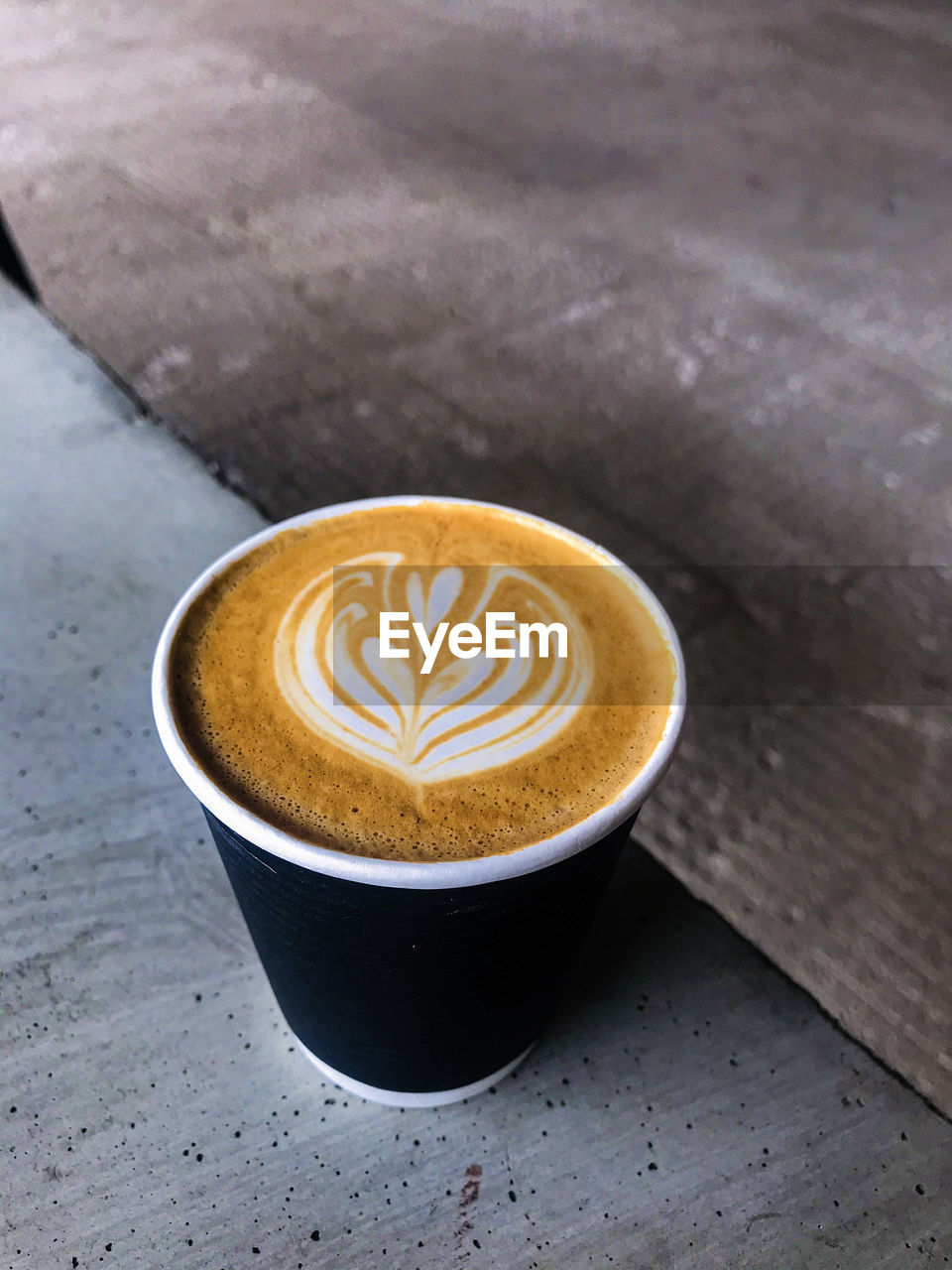 A cup of latte art in coffee shop