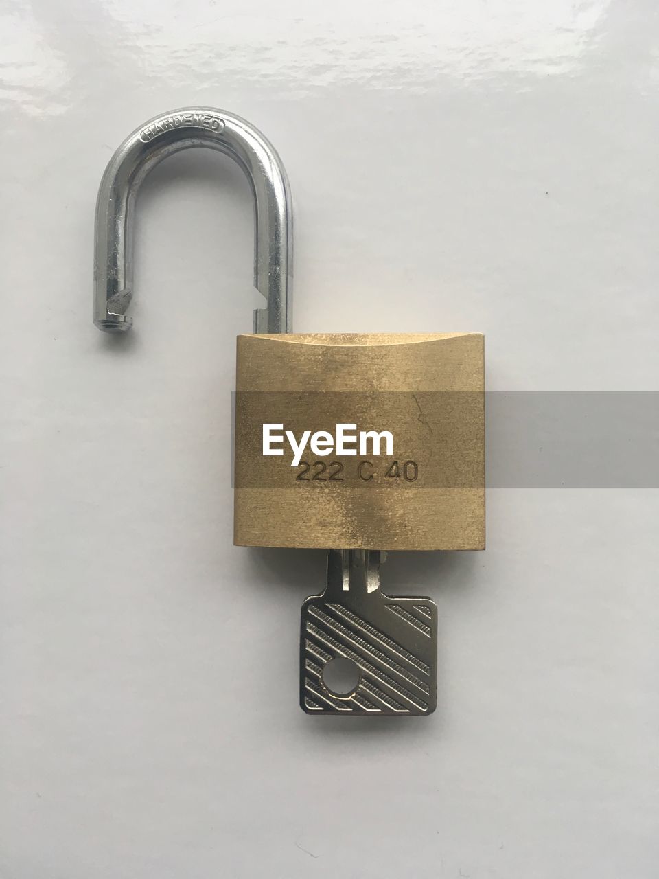 CLOSE-UP OF PADLOCK ON METAL