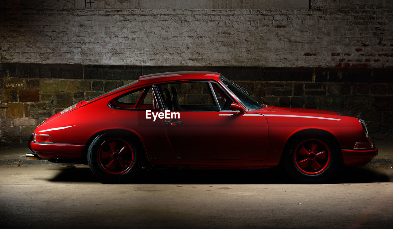 CLOSE-UP OF CAR ON ROAD