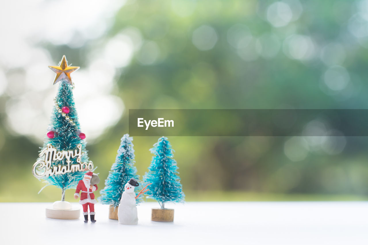 Close-up of christmas decorations on table outdoors