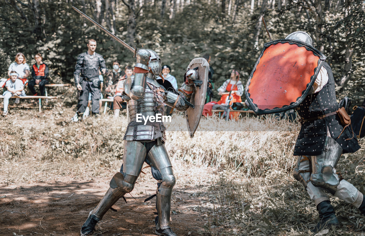 View of warrior standing on field