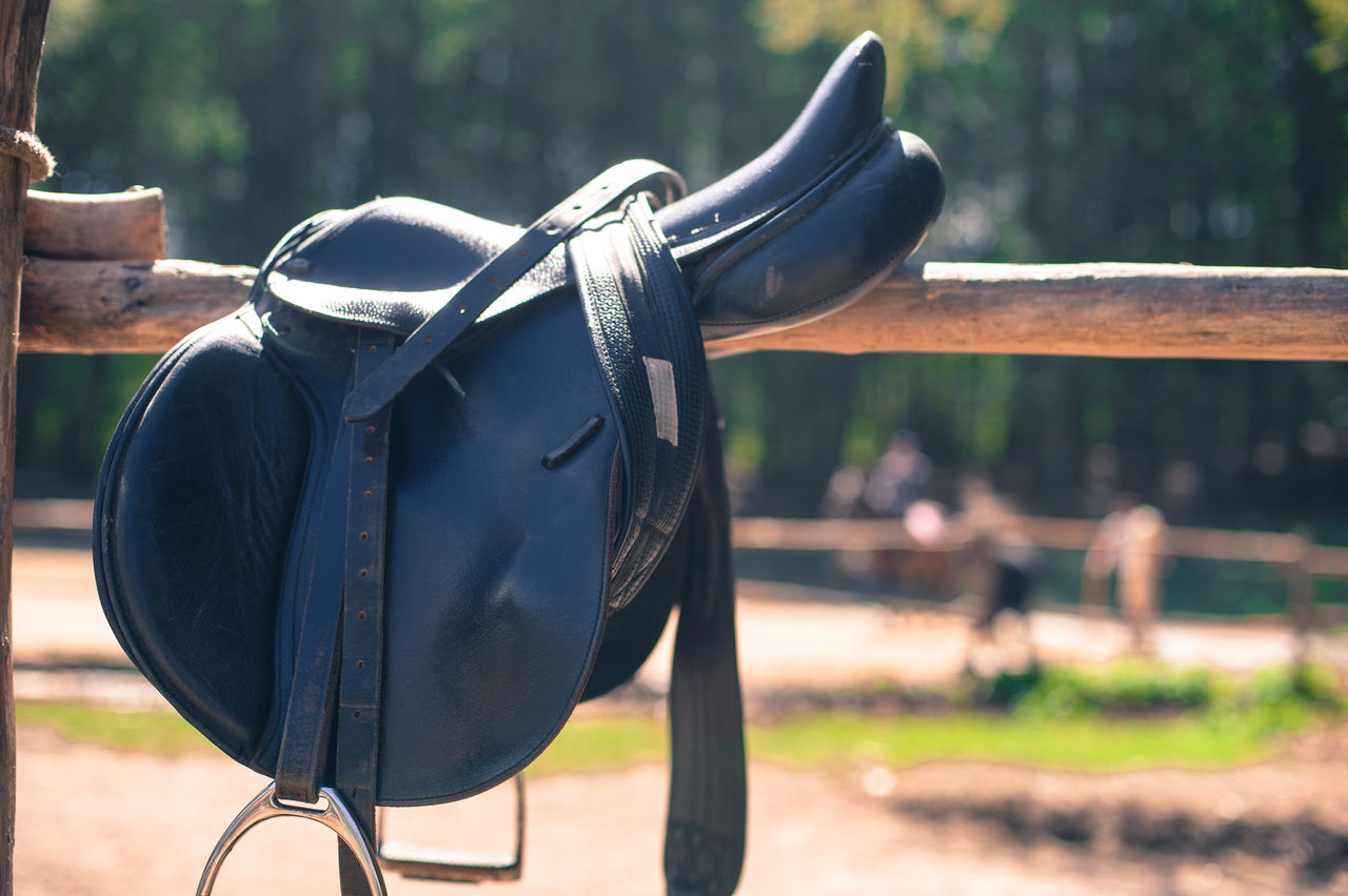 Saddle on wooden railing