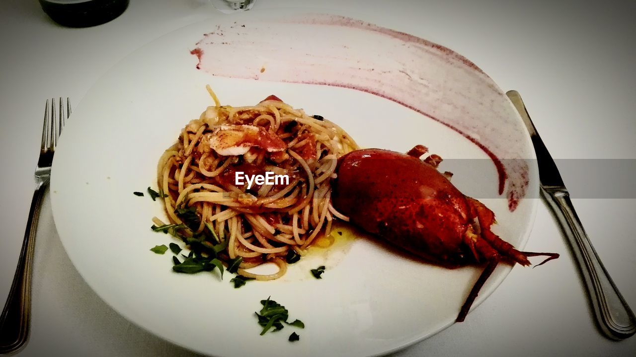 CLOSE-UP OF SERVED FOOD IN PLATE WITH SAUCE