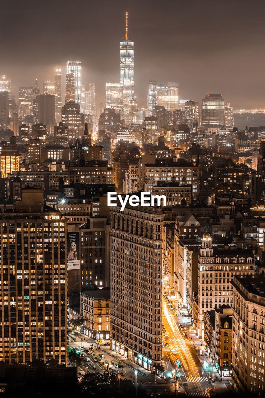 Aerial view of illuminated city at night