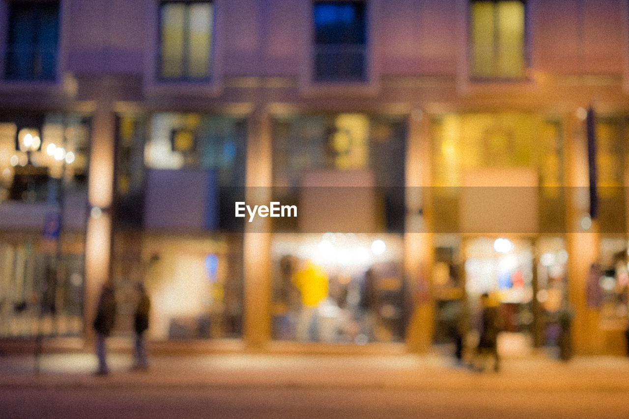 VIEW OF ILLUMINATED BUILDING AT NIGHT