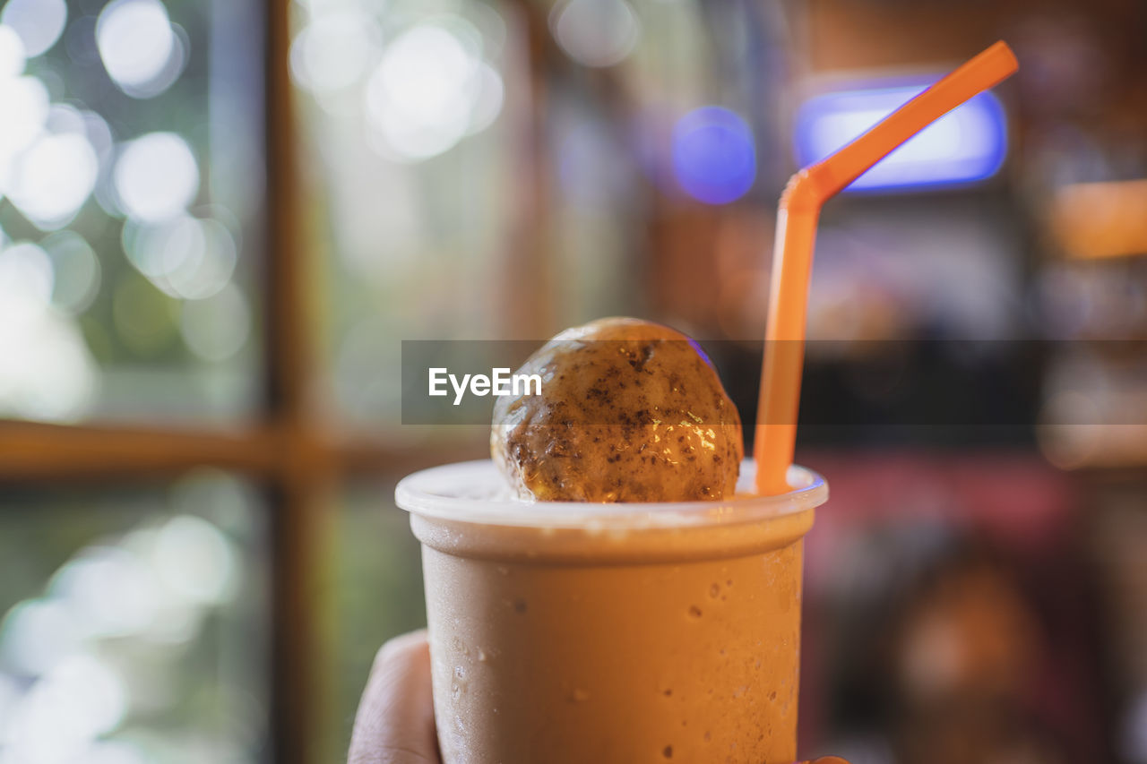 CLOSE-UP OF ICE CREAM WITH COFFEE