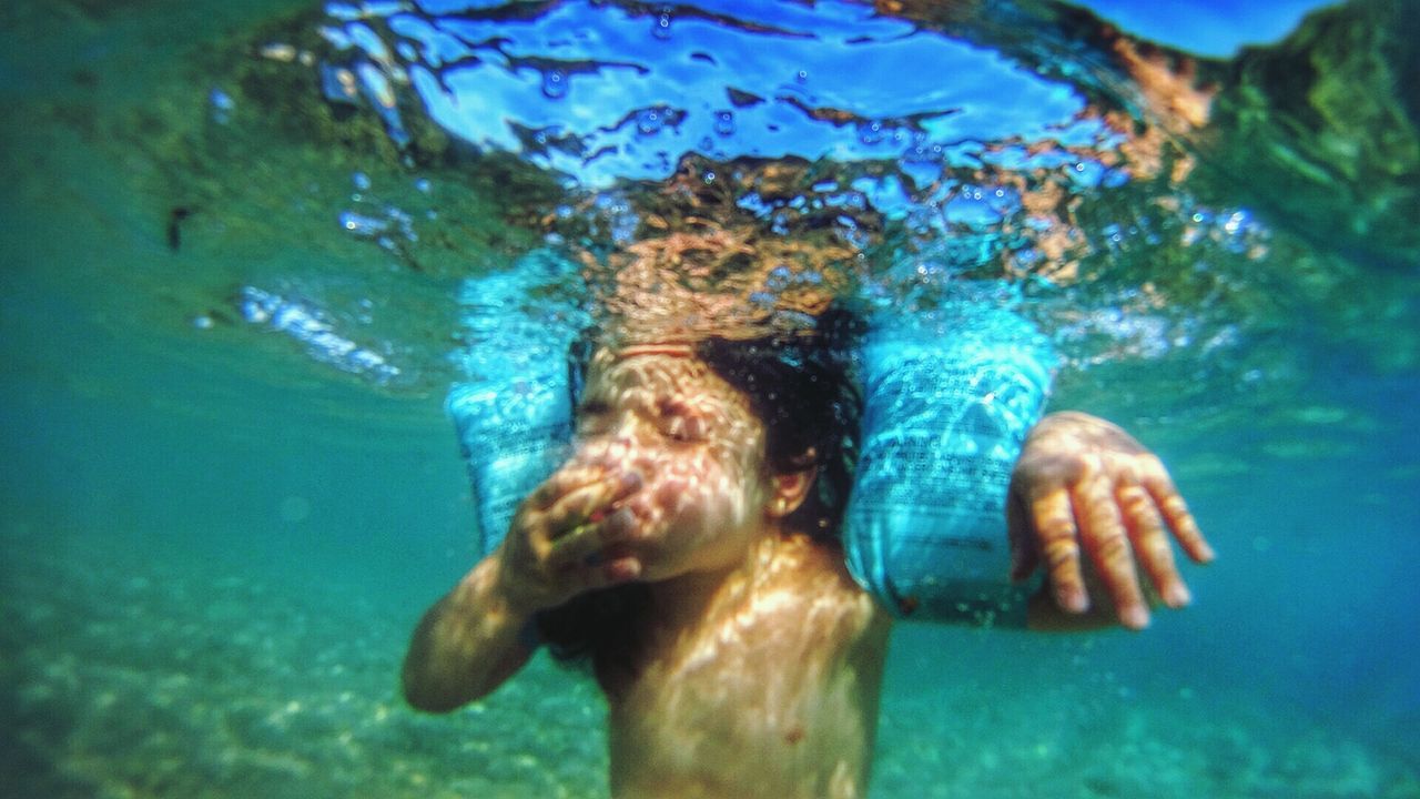 Underwater view of young girl