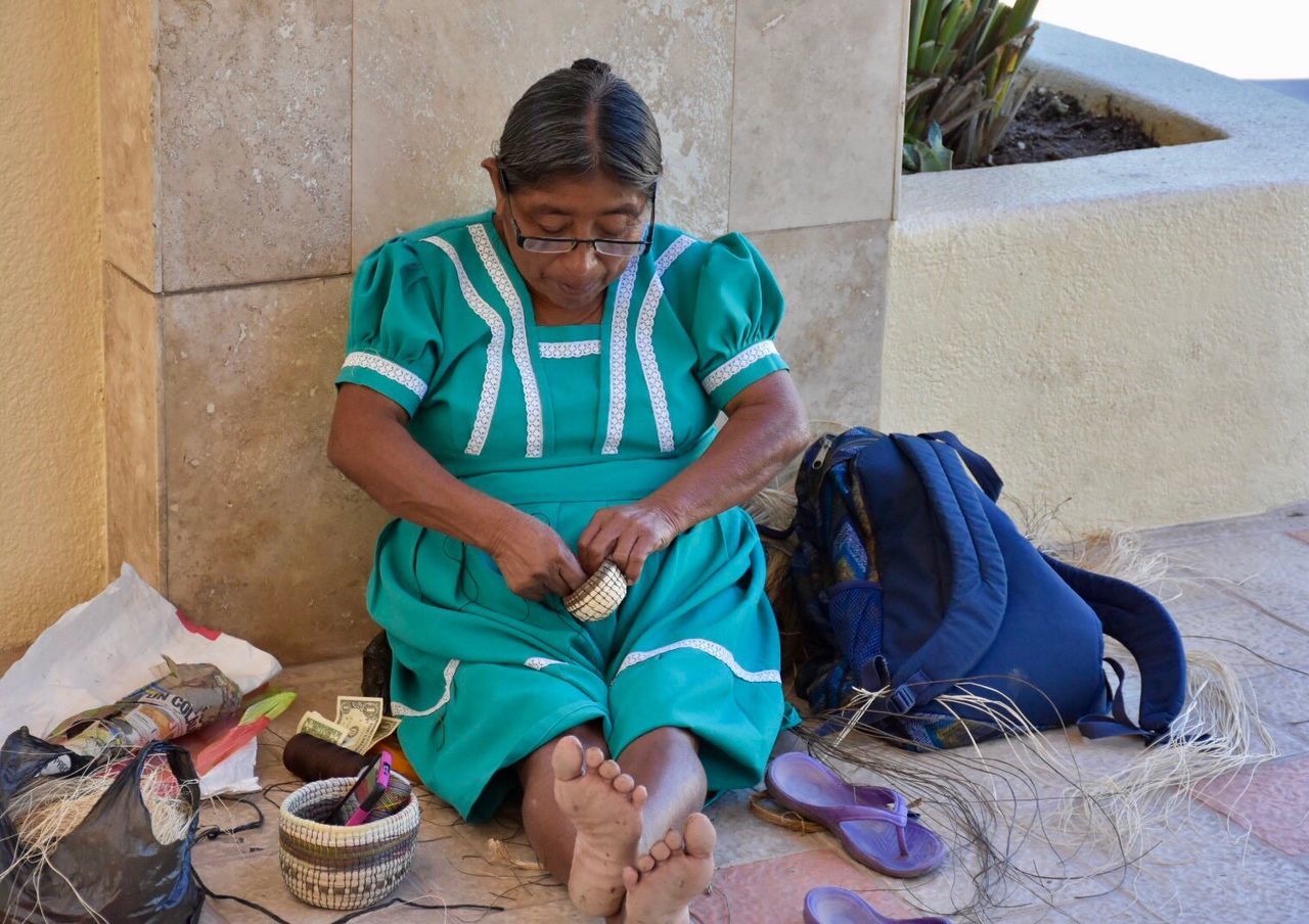Woman sitting on street