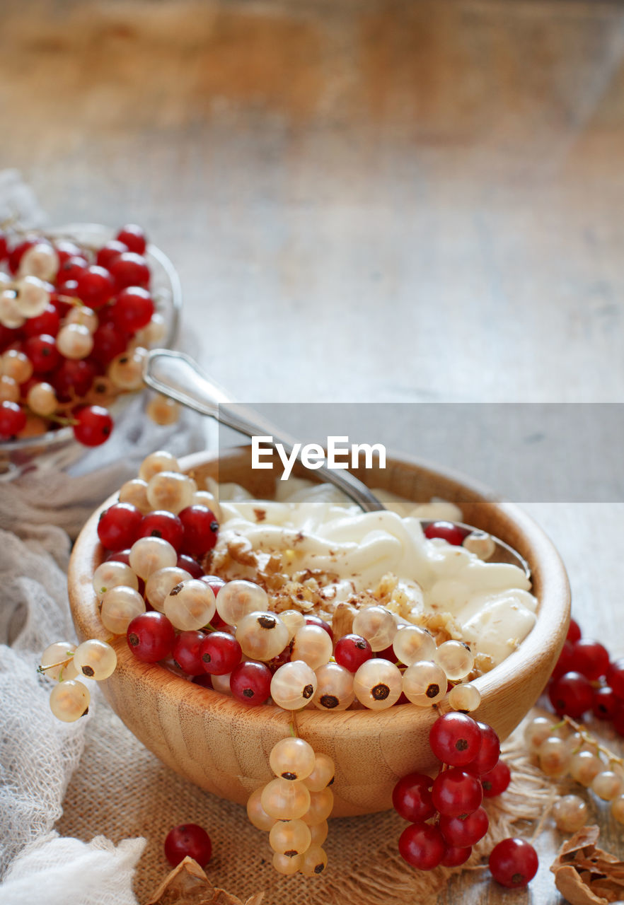 CLOSE-UP OF RASPBERRIES WITH ICE CREAM